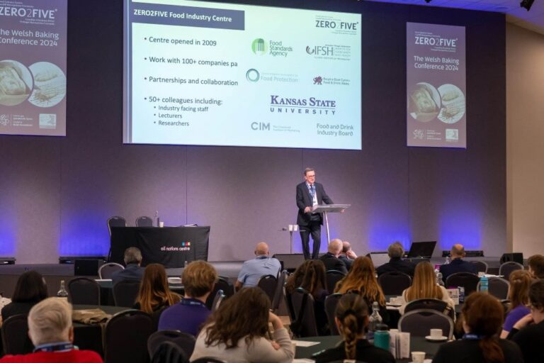 Professor David Lloyd on stage at the Welsh Bakery conference