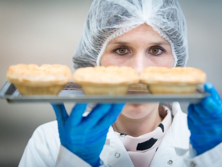 Technologist holding pies