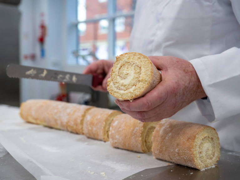 Swiss roll being chopped