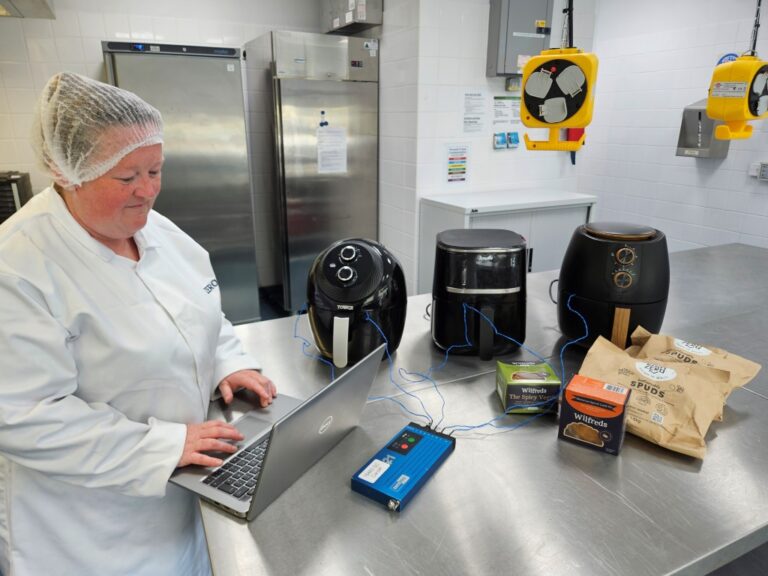 ZERO2FIVE technical manager carries out airfryer cooking trials in development kitchen