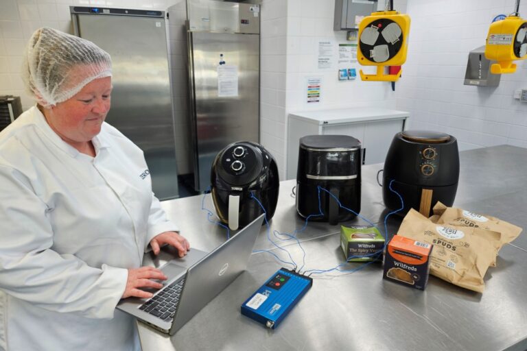 ZERO2FIVE technical manager carries out airfryer cooking trials in development kitchen