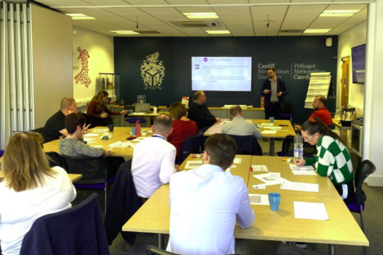 People attending food fraud workshop around table