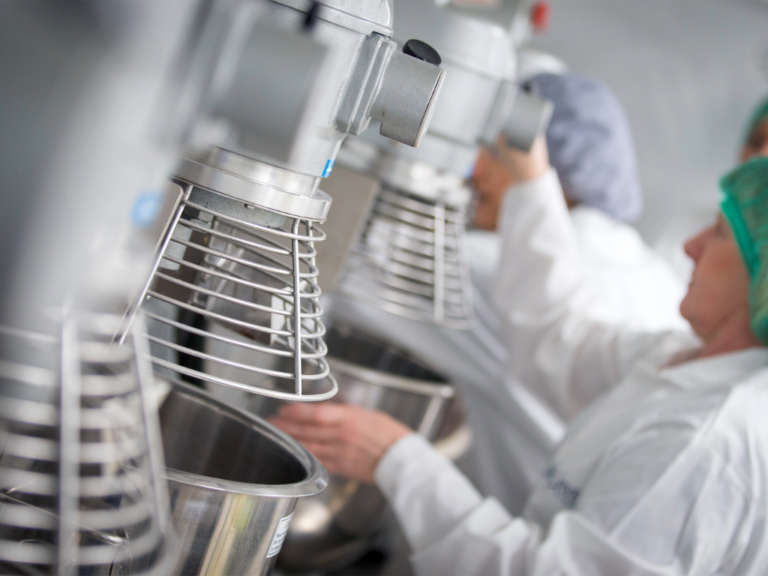 Food technologists using bread mixers