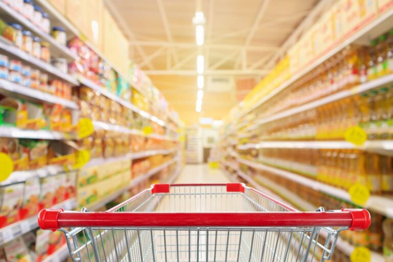 Shopping trolley in a supermarket aisle
