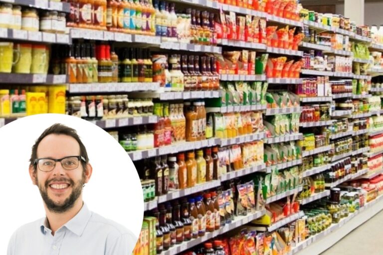 Ed Gilbert superimposed over a supermarket aisle