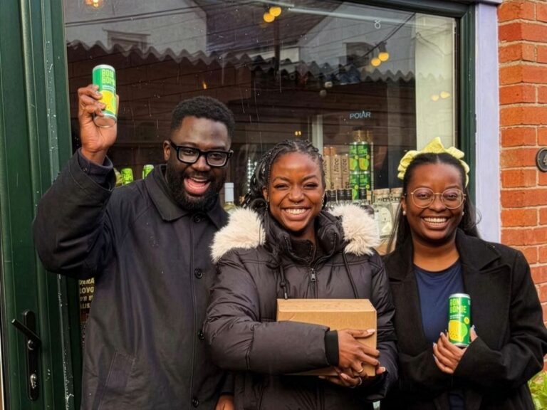 Wayne, Kimberly and Adrina holding cans of Bon Homie drink